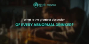 An image from Narcotics Anonymous Pakistan featuring a blurred person at a bar with the text, "What is the greatest obsession OF EVERY ABNORMAL DRINKER?"
